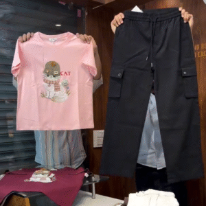 Playful Edge: Pink Cartoon Cat Tee with Black Cargo Pants