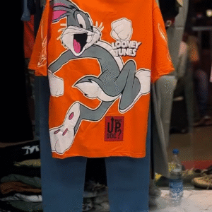 Bold & Casual: Orange Graphic T-Shirt with Baggy Jeans